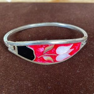 Silver bracelet with mother of pearl and onyx inlay.